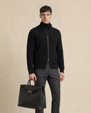 Man wearing the VAËL Lēon wool zip cardigan with ribbed collar