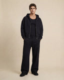 Man wearing the VAËL ORÉN full-zip hooded sweatshirt