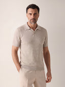Man wearing the VAËL Isídro slim-fit knit polo in oat