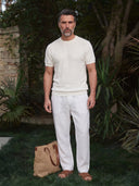 Man wearing the VAËL Bravía textured knit T-shirt in white