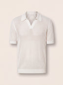 Man wearing the VAËL Sorélo open-knit polo in ivory
