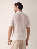 Man wearing the VAËL Sorélo open-knit polo in ivory