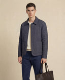 Man wearing the VAËL Tēron lightweight quilted jacket