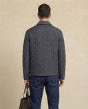 Man wearing the VAËL Tēron lightweight quilted jacket