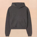 Man wearing the VAËL Varēk cropped cotton hooded sweatshirt