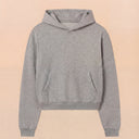 Man wearing the VAËL Varēk cropped cotton hooded sweatshirt