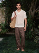 Man wearing the VAËL Sorélo open-knit polo in ivory