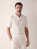 Man wearing the VAËL Aurélio open-collar knit polo in white