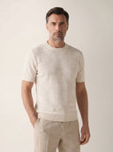 Man wearing the VAËL Bravía textured knit T-shirt in white
