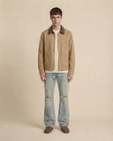 Man wearing the VAËL Cadré canvas workwear jacket with leather collar