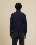Man wearing the VAËL Caël ribbed half-zip wool sweater