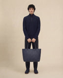 Man wearing the VAËL Caël ribbed half-zip wool sweater