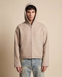 Man wearing the VAËL Sōva cropped wool zip hoodie