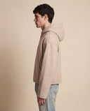 Man wearing the VAËL Sōva cropped wool zip hoodie