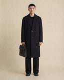 Man wearing the VAËL Zerōn long wool overcoat