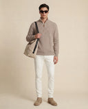 Man wearing the VAËL Caël ribbed half-zip wool sweater