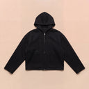 Man wearing the VAËL Sōva cropped wool zip hoodie