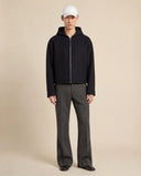 Man wearing the VAËL Sōva cropped wool zip hoodie