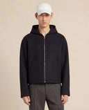 Man wearing the VAËL Sōva cropped wool zip hoodie