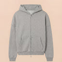 Man wearing the VAËL ORÉN full-zip hooded sweatshirt