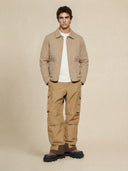 Man wearing the VAËL Tēron lightweight quilted jacket