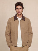 Man wearing the VAËL Cadré canvas workwear jacket with leather collar