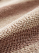 Man wearing the VAËL Solário striped knit T-shirt in earth tones