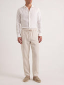 Man wearing the VAËL Seréno drawstring linen trousers