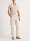 Man wearing the VAËL Leóndro straight-leg cotton trousers in white