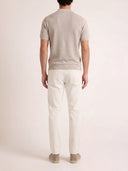 Man wearing the VAËL Isídro slim-fit knit polo in oat