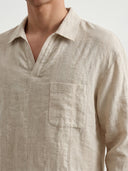 Man wearing the VAËL Solano open-collar linen shirt in beige
