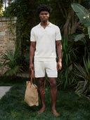 Man wearing the VAËL Aurélio textured knit shorts in white
