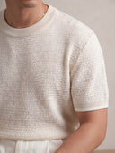 Man wearing the VAËL Bravía textured knit T-shirt in white