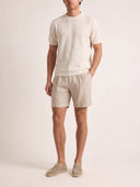 Man wearing the VAËL Bravía textured knit T-shirt in white