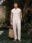 Model wearing the VAËL Rocío sleeveless knit top in white