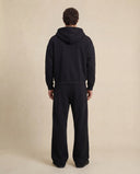 Man wearing the VAËL ORÉN full-zip hooded sweatshirt