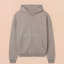 Man wearing the VAËL ORÉN full-zip hooded sweatshirt